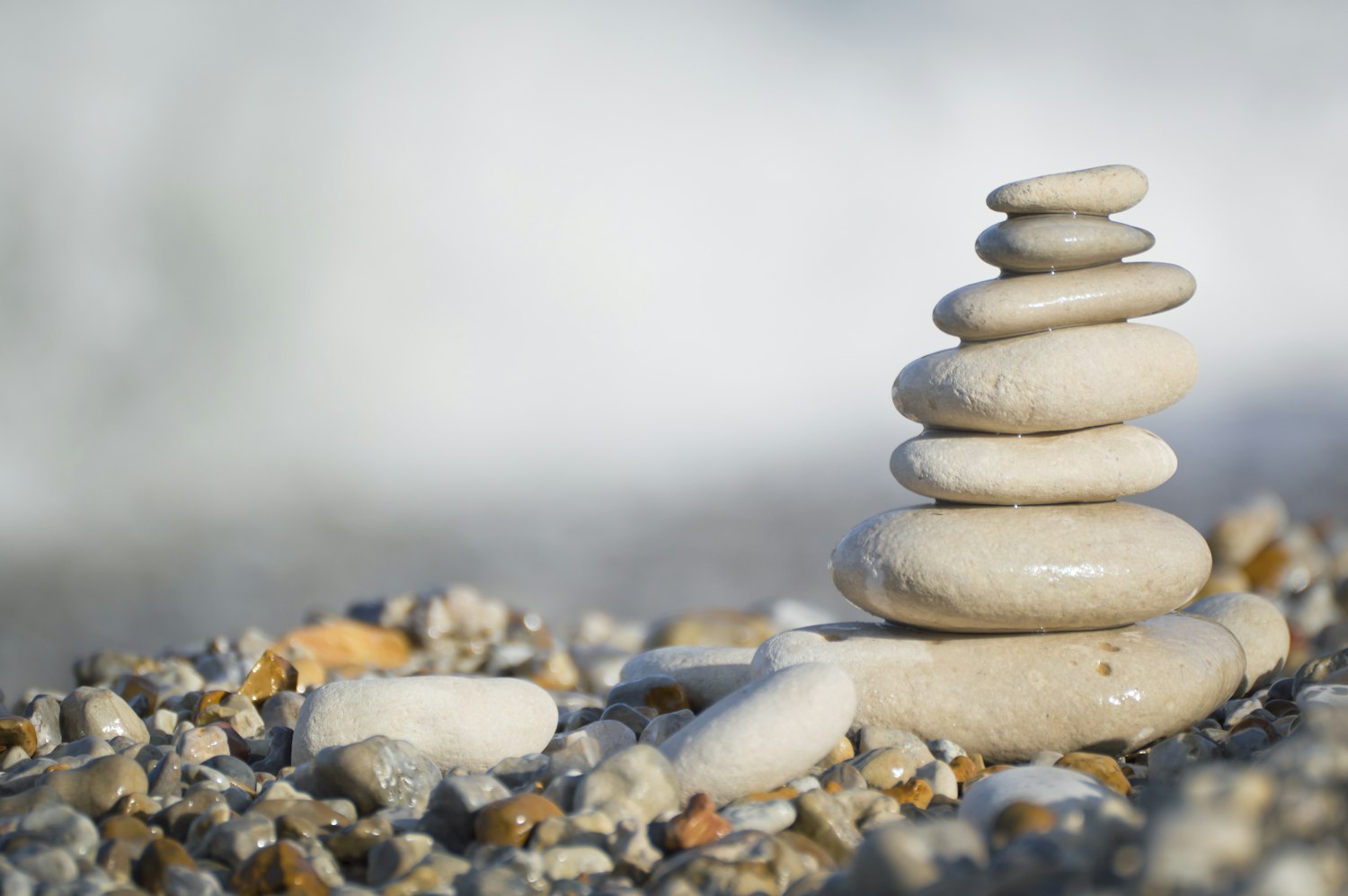 Stack of smooth stones on a pebble beach